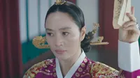 Cena do episódio 11 de Papel de Rainha